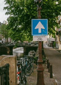 Dutch bicycle-friendly traffic sign allowing bike access on a one-way street in Amsterdam.