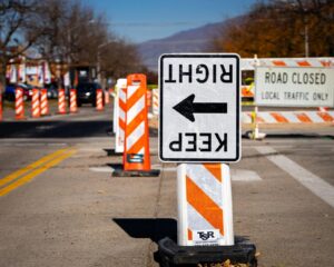 Construction cones and a “Keep Right” traffic sign directing vehicles away from a closed lane